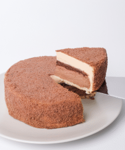 When melt-in-your-mouth cheesecake meets nutty, creamy, and bittersweet taste flavors.. Oh, a pure heaven! This Fromage consists of sponge cake, chocolate baked cheese, hazelnut praline layer with a crunchy touch of Pailleté Feuilletine, hazelnut mousse, then covered with hazelnut soboro.